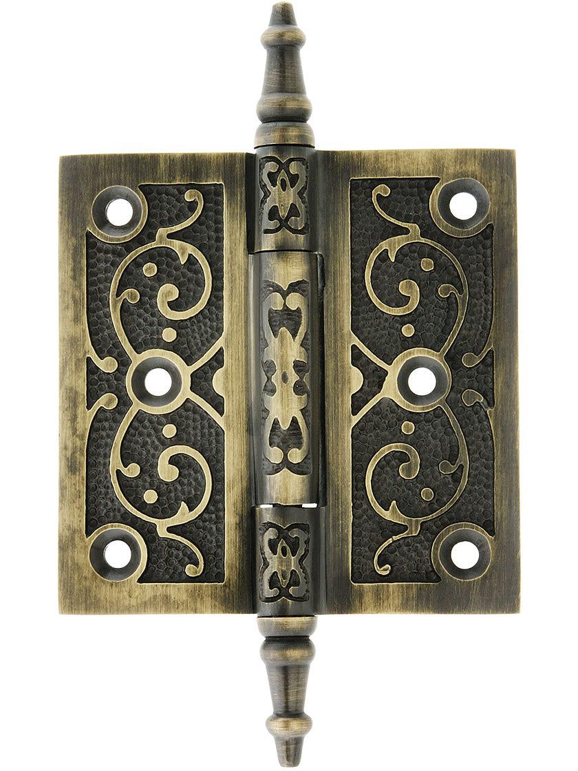 3 1/2 inch Solid Brass Steeple Tip Hinge With Decorative Vine Pattern in Antique Brass.